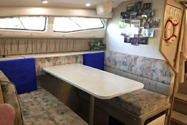 Slide: The Image of Interior of 1999 Bayliner 2855 Ciera with cozy dining area and decor. - 14