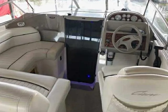 Slide: The Image of 1999 Bayliner 2855 Ciera boat interior with steering wheel and seating area. - 15
