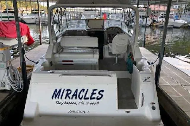Slide: The Image of 1999 Bayliner 2855 Ciera boat named "MIRACLES" docked at marina, Johnston, IA. - 19