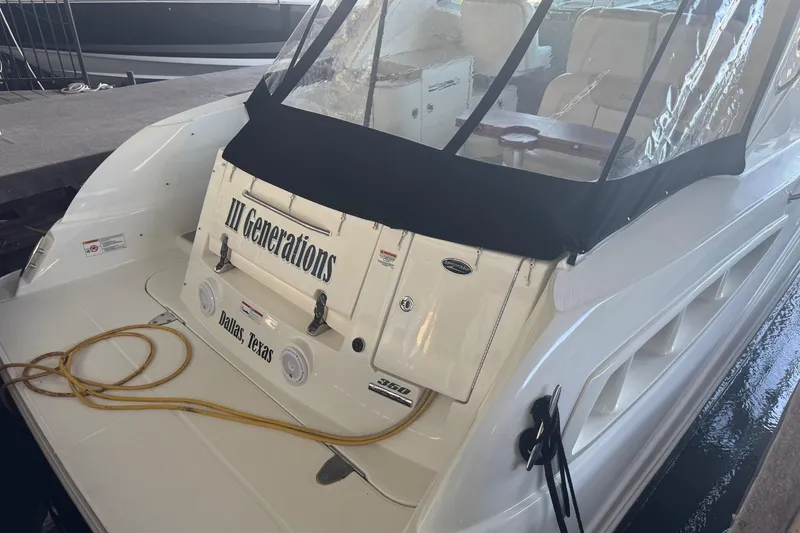 Slide: The Image of 2010 Sea Ray 350 Sundancer boat docked, named "III Generations," located in Dallas, Texas. - 10