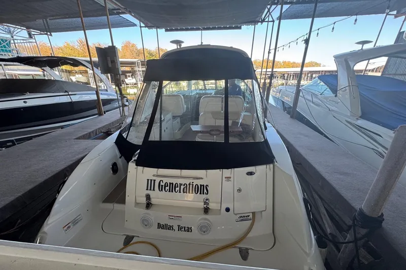 Slide: The Image of 2010 Sea Ray 350 Sundancer docked, named "III Generations," located in Dallas, Texas. - 11