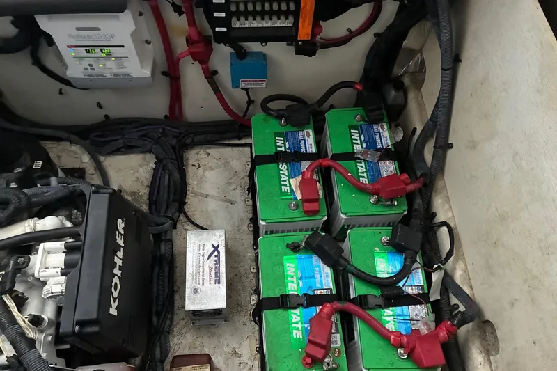 Slide: The Image of Engine compartment of 2010 Sea Ray 350 Sundancer with batteries and Kohler generator. - 30