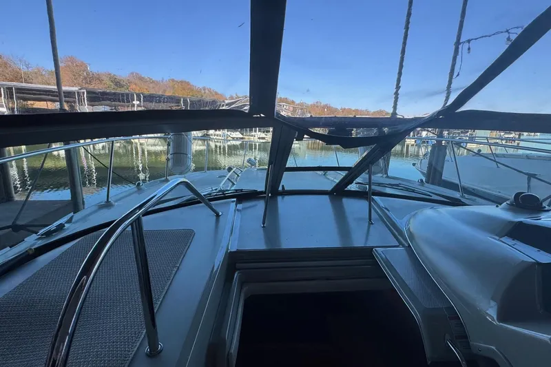 Slide: The Image of 2010 Sea Ray 350 Sundancer yacht interior view at marina, clear sky, calm waters. - 7