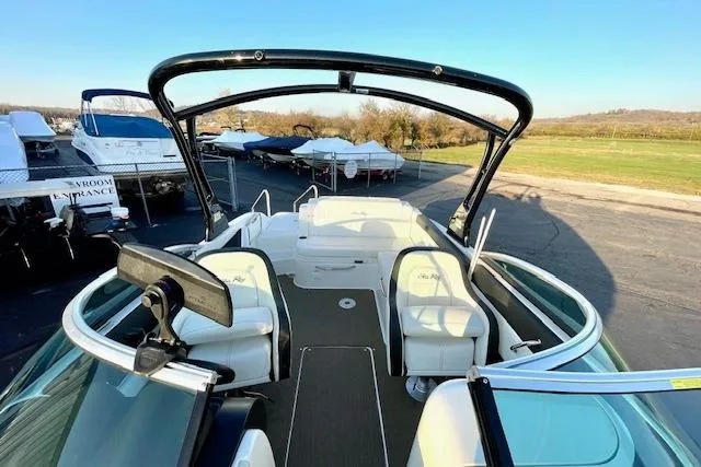 Slide: The Image of 2014 Sea Ray 260 Sundeck boat with spacious seating and sleek design. - 14