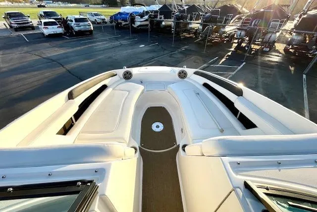 Slide: The Image of 2014 Sea Ray 260 Sundeck boat interior with spacious seating and sunlit deck. - 21