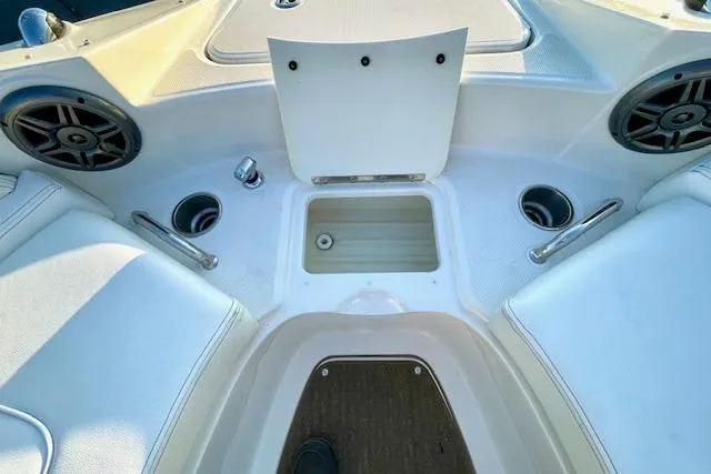 Slide: The Image of 2014 Sea Ray 260 Sundeck interior with storage compartment and cup holders. - 22