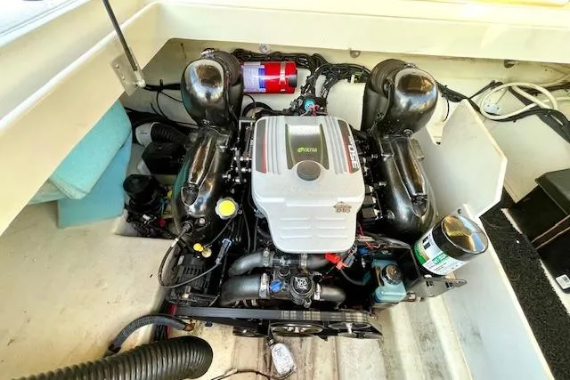 Slide: The Image of Engine compartment of a 2014 Sea Ray 260 Sundeck boat, featuring a well-maintained motor. - 27
