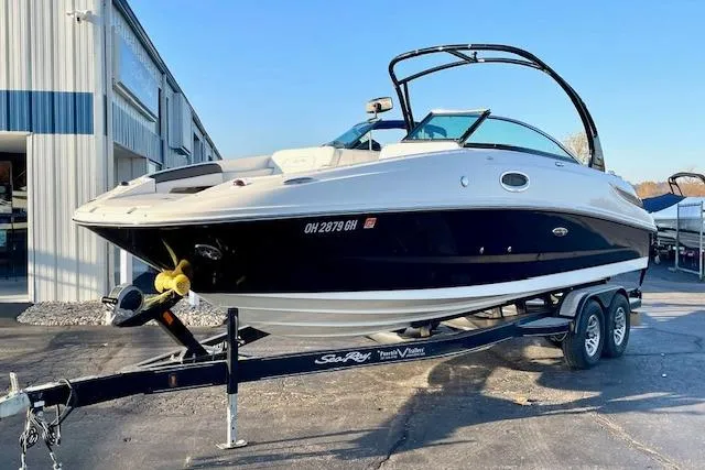 Slide: The Image of 2014 Sea Ray 260 Sundeck boat on trailer, parked outside a building. - 3
