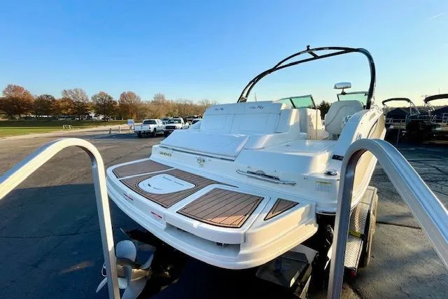 Slide: The Image of 2014 Sea Ray 260 Sundeck boat on trailer, rear view, in outdoor setting. - 7
