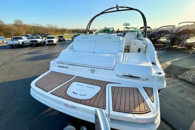 Slide: The Image of 2014 Sea Ray 260 Sundeck boat with spacious deck and sleek design. - 8