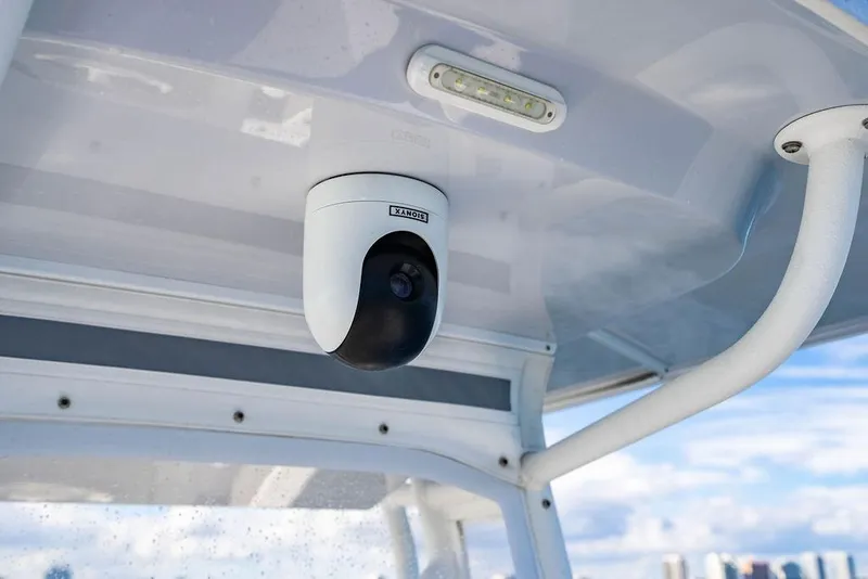 Slide: The Image of Security camera on 2026 Reef Runner 230 boat, mounted under canopy. - 42