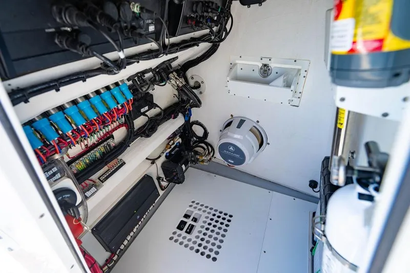 Slide: The Image of Electrical system inside 2026 Reef Runner 230 boat, featuring wiring and components. - 51