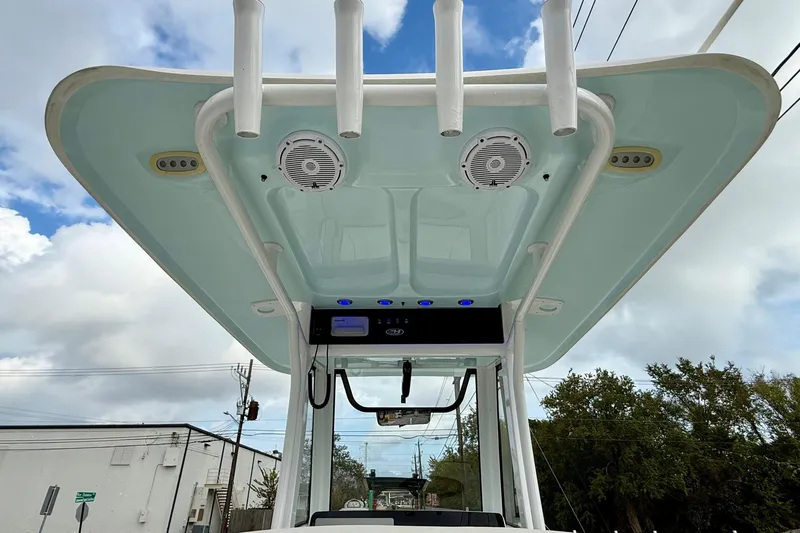 Slide: The Image of 2021 Sea Hunt BX 25 FS boat with T-top and speakers, viewed from below. - 12