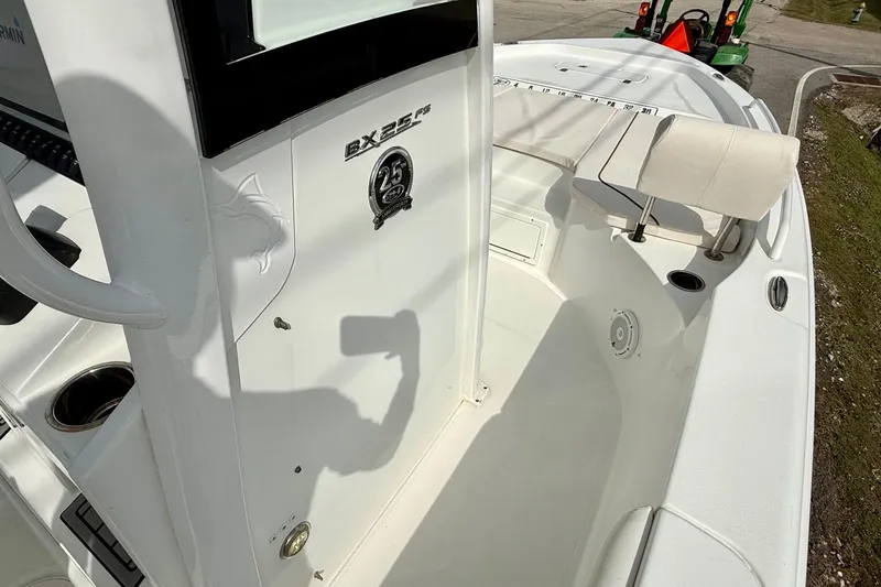 Slide: The Image of 2021 Sea Hunt BX 25 FS boat interior with seating and console details. - 16