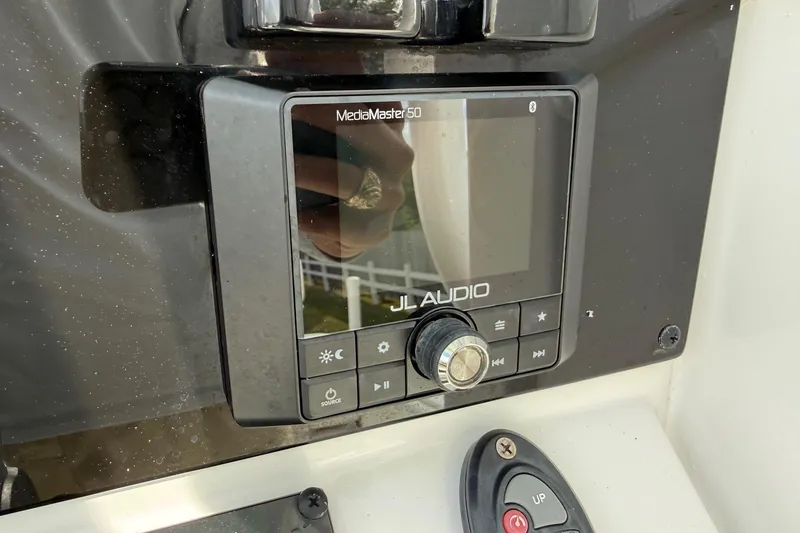 Slide: The Image of JL Audio MediaMaster 50 on 2021 Sea Hunt BX 25 FS boat dashboard. - 19