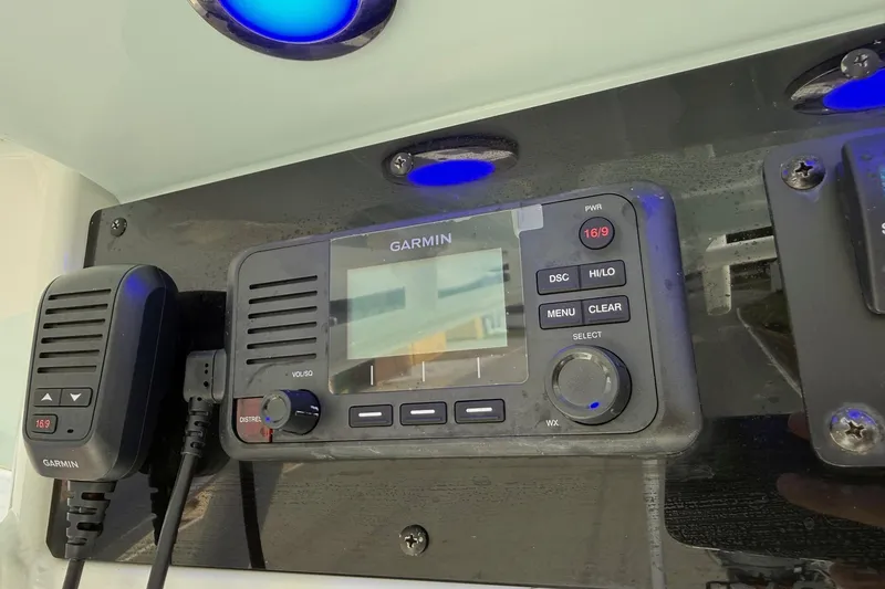 Slide: The Image of Garmin marine radio on 2021 Sea Hunt BX 25 FS boat dashboard with blue LED lights. - 20