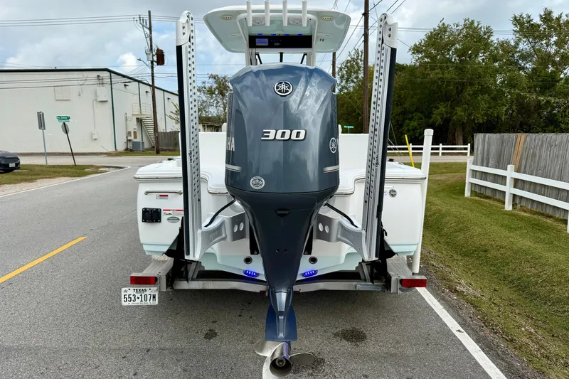 Slide: The Image of 2021 Sea Hunt BX 25 FS boat with Yamaha 300 engine on trailer. - 3