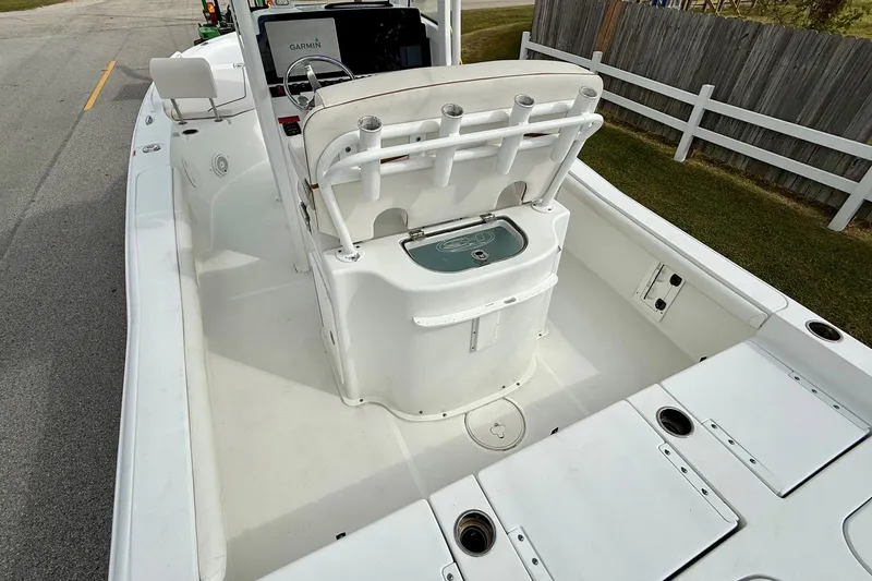 Slide: The Image of 2021 Sea Hunt BX 25 FS boat interior with fishing rod holders and Garmin equipment. - 9