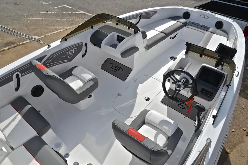 Slide: The Image of 2024 Tahoe T21 boat interior with modern seating and steering console. - 19