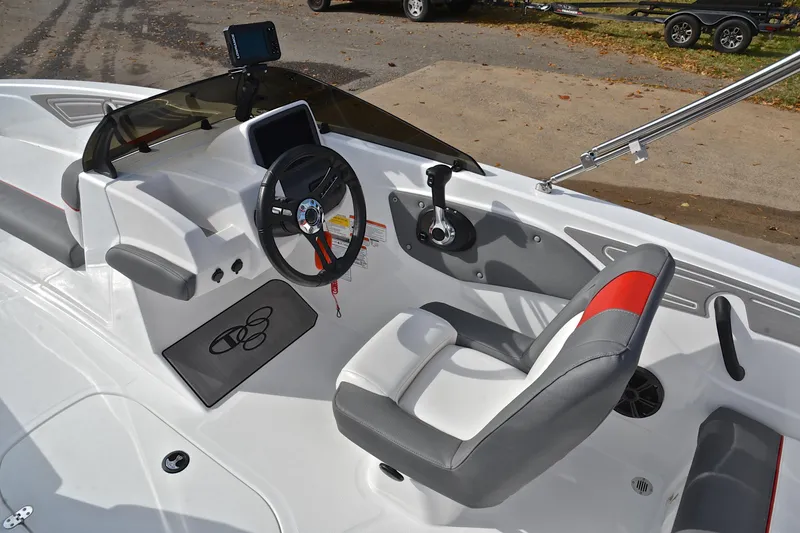 Slide: The Image of 2024 Tahoe T21 boat cockpit with steering wheel, control panel, and seating. - 24