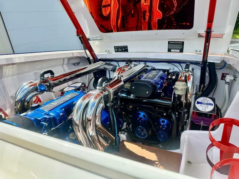 Slide: The Image of 2005 Cigarette 39 Top Gun engine compartment with polished chrome and blue accents. - 21