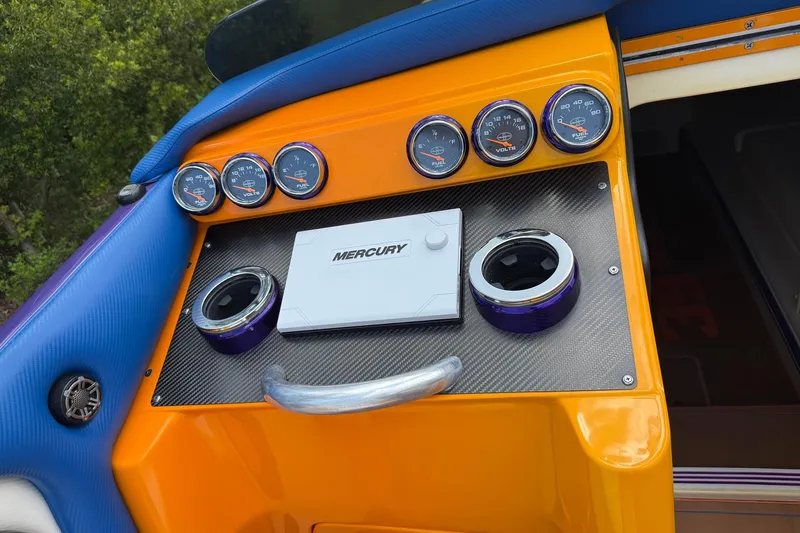 Slide: The Image of Dashboard of a 2005 Cigarette 39 Top Gun Unlimited boat with Mercury controls. - 32