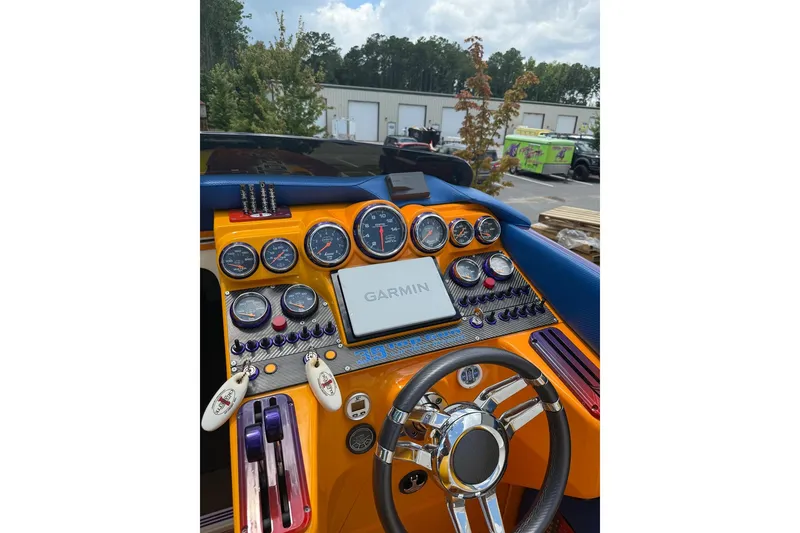 Slide: The Image of Dashboard of a 2005 Cigarette 39 Top Gun Unlimited boat with Garmin navigation system. - 34