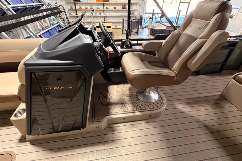 Slide: The Image of Captain's chair and helm of 2026 Veranda VR 265 VL boat, featuring luxurious seating. - 15