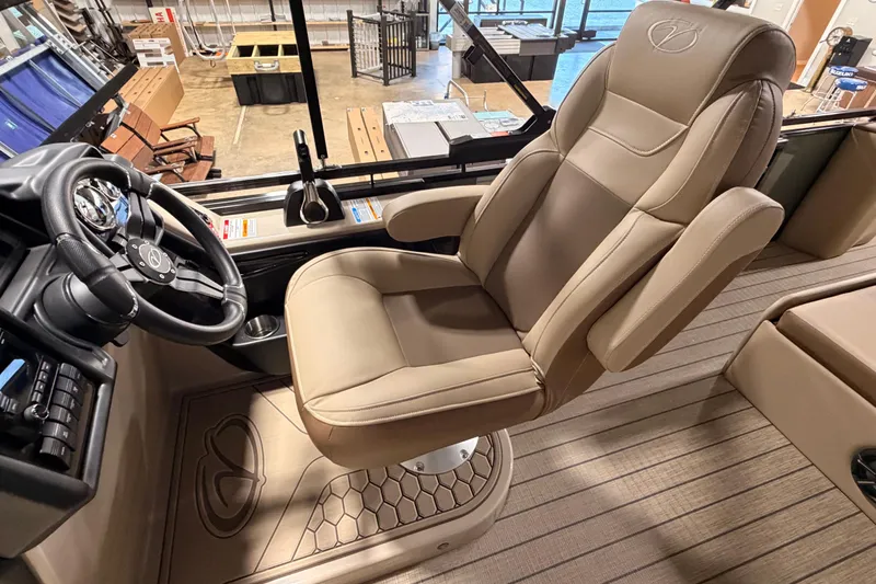 Slide: The Image of Captain's chair in 2026 Veranda VR 265 VL boat, featuring luxurious beige upholstery. - 17