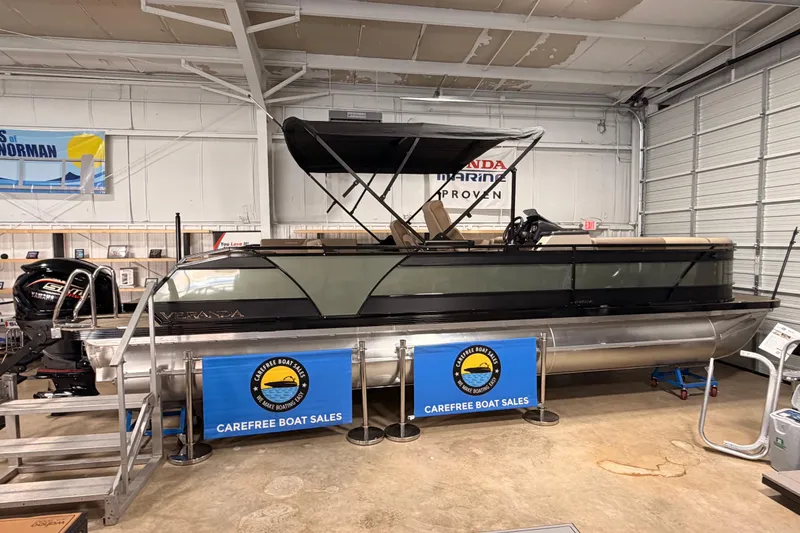 Slide: The Image of 2026 Veranda VR 265 VL pontoon boat displayed at Carefree Boat Sales showroom. - 2