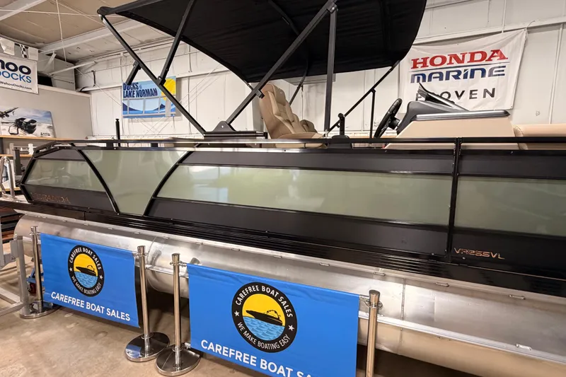Slide: The Image of 2026 Veranda VR 265 VL pontoon boat displayed at Carefree Boat Sales showroom. - 3