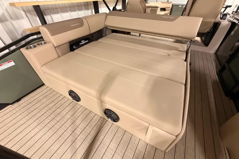 Slide: The Image of 2026 Veranda VR 265 VL boat interior with beige seating and cup holders. - 8
