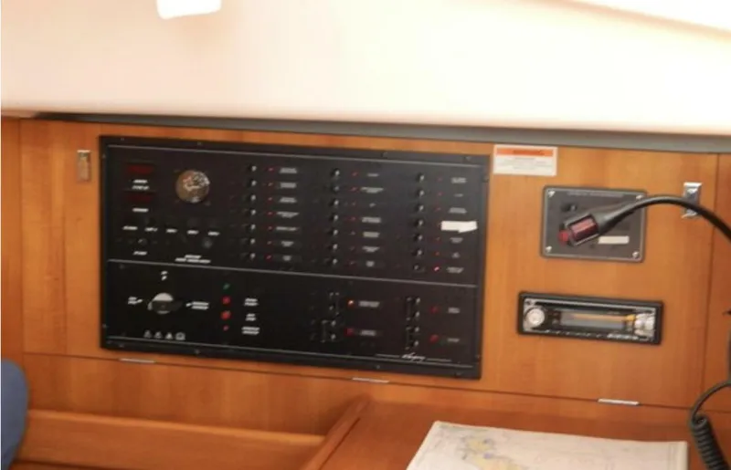 Slide: The Image of Control panel of a 2003 Wauquiez 40 Pilot Saloon yacht, featuring navigation and electrical systems. - 15