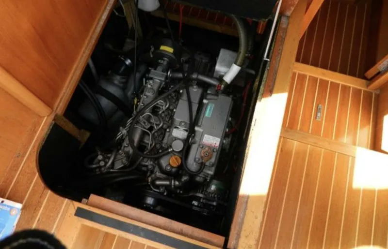 Slide: The Image of Engine compartment of 2003 Wauquiez 40 Pilot Saloon yacht, showcasing detailed mechanical components. - 18