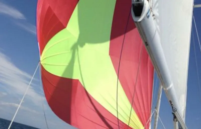 Slide: The Image of Colorful sail on a 2003 Wauquiez 40 Pilot Saloon yacht against a clear blue sky. - 3