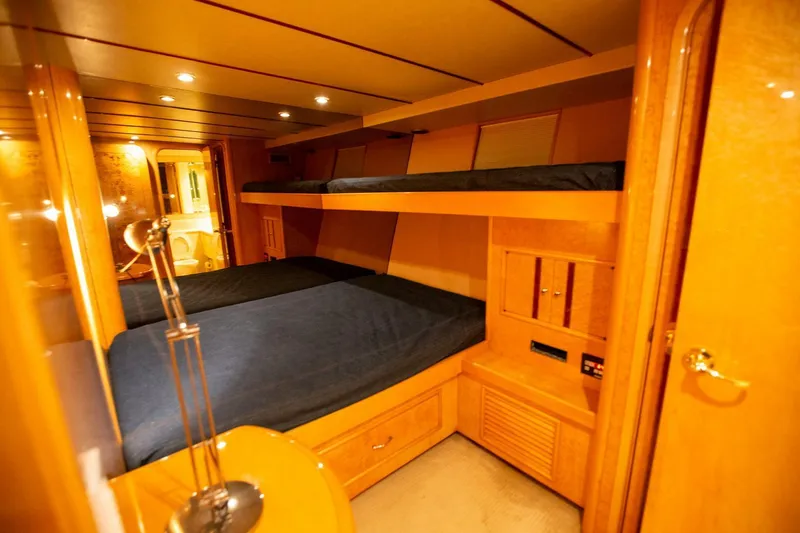 Slide: The Image of Luxurious cabin interior of 1999 Tarrab Motor Yacht with wooden furnishings and cozy lighting. - 15