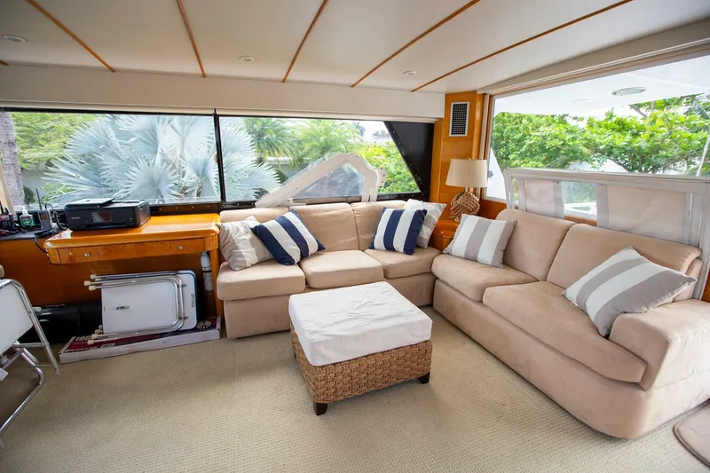 Slide: The Image of Luxurious interior of a 1999 Tarrab Motor Yacht with beige sofas and striped cushions. - 24