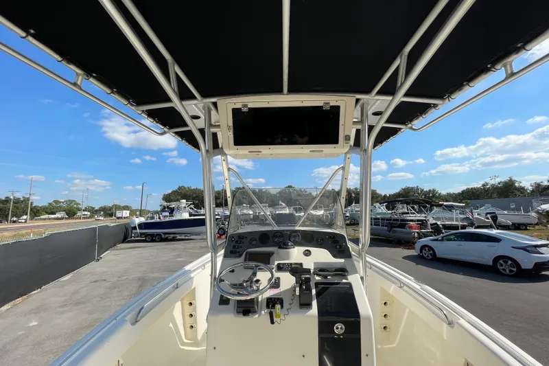 Slide: The Image of Center console view of a 2000 SC boat with steering wheel and controls. - 16