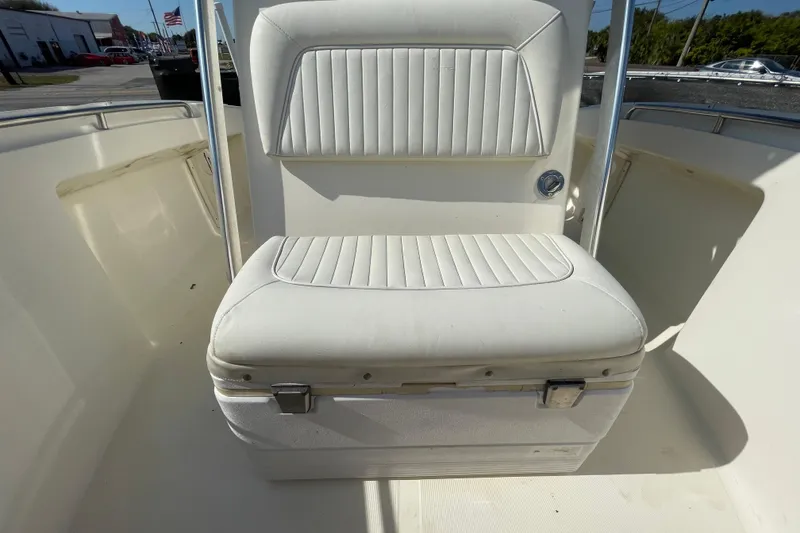 Slide: The Image of White boat seat with storage compartment, SC make, 2000 model, outdoor setting. - 40