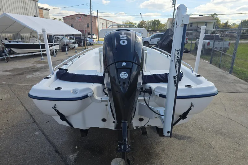 Slide: The Image of 2004 Fishmaster 1960 boat with powerful outboard motor in a marina setting. - 4