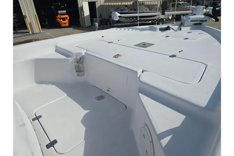 Slide: The Image of 2004 Fishmaster 1960 boat deck with storage compartments and fishing equipment. - 8