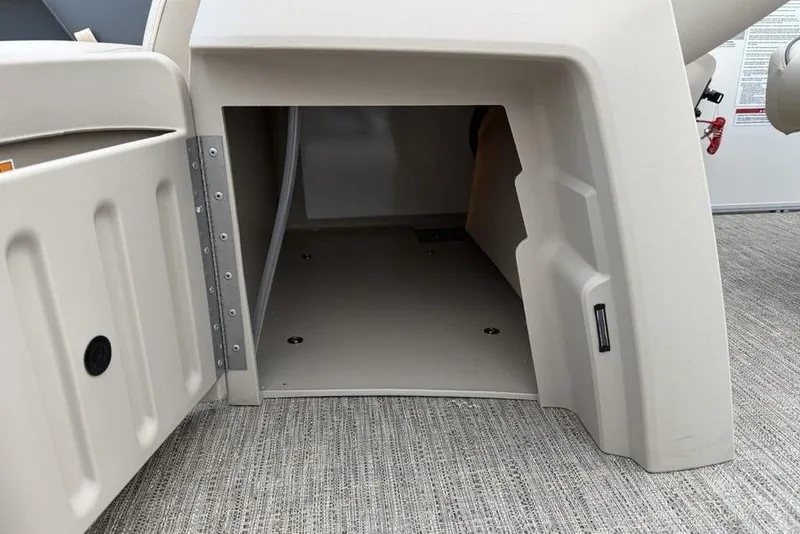 Slide: The Image of Open storage compartment on 2026 Godfrey Sweetwater 2286 SFLC pontoon boat. - 11