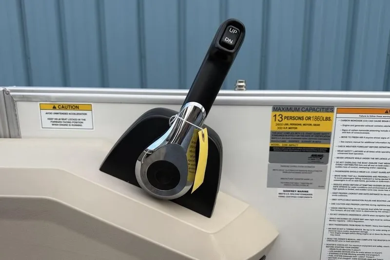 Slide: The Image of Throttle control and capacity labels on 2026 Godfrey Sweetwater 2286 SFLC boat. - 15