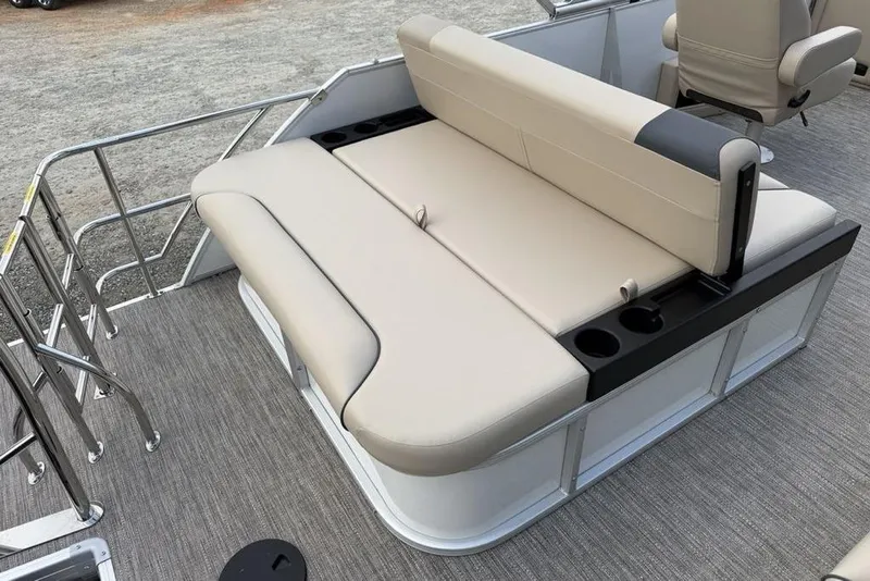 Slide: The Image of 2026 Godfrey Sweetwater 2286 SFLC boat seating area with beige upholstery and cup holders. - 20