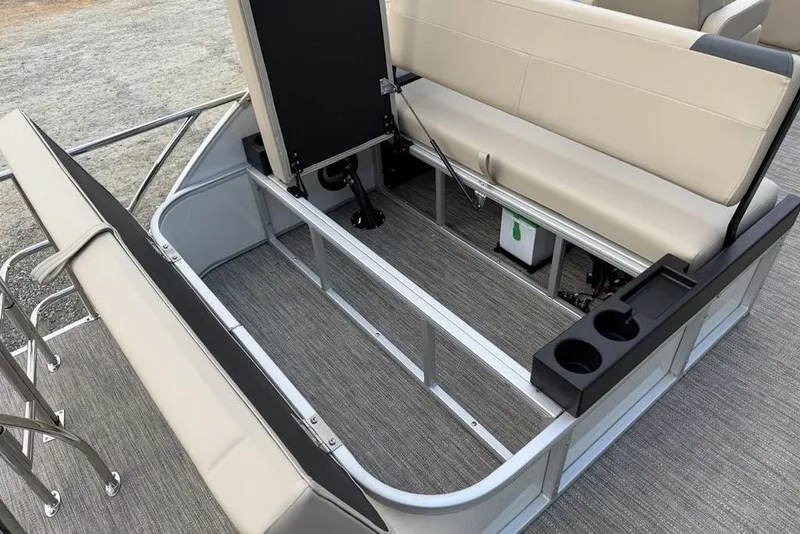 Slide: The Image of 2026 Godfrey Sweetwater 2286 SFLC boat interior with beige seating and cup holders. - 21