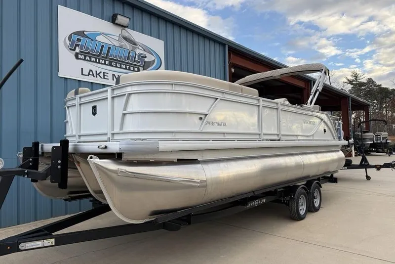 Slide: The Image of 2026 Godfrey Sweetwater 2286 SFLC pontoon boat on trailer at Foothills Marine Center. - 3