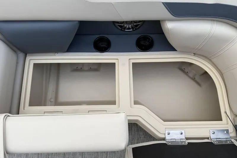 Slide: The Image of Interior storage compartment of 2026 Godfrey Sweetwater 2286 SFLC boat with cup holders. - 6