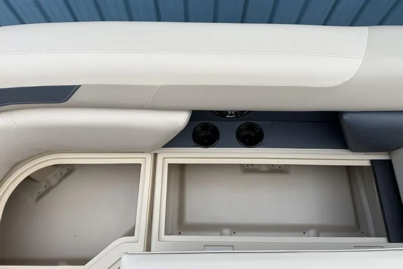 Slide: The Image of Interior view of 2026 Godfrey Sweetwater 2286 SFLC boat with storage compartment and cup holders. - 7