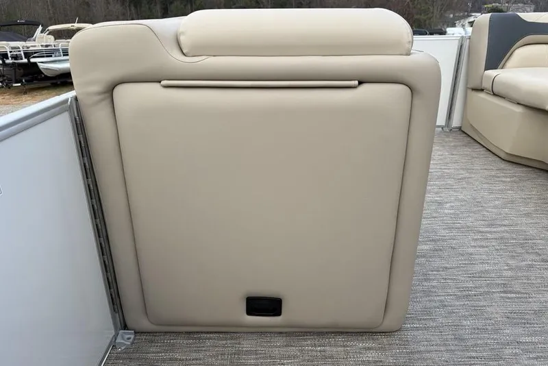 Slide: The Image of 2026 Godfrey Sweetwater 2286 SFLC boat interior with beige seating and carpeted flooring. - 9