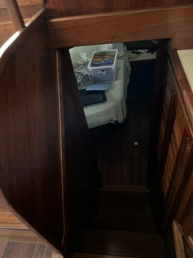 Slide: The Image of Interior view of 1987 Californian 42 Motor Yacht with wooden stairs and cozy cabin. - 19